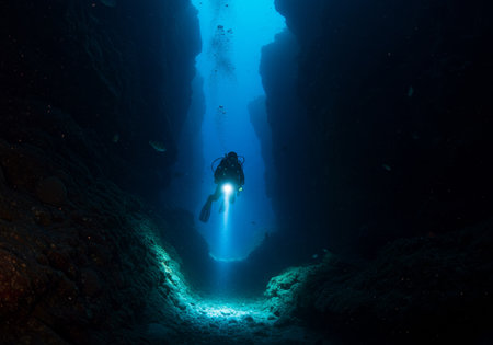 Silhouette of a diver at the entrance to the cave.