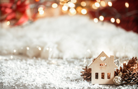 Cozy winter christmas background with bokeh and wooden decor details on a light background.の写真素材
