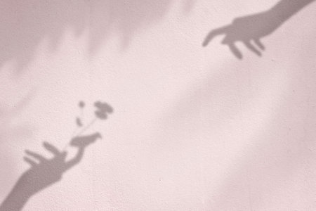 background with flower in hand shadowの写真素材