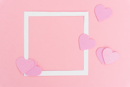 Valentines day frame on pink background with copy spaceの写真素材