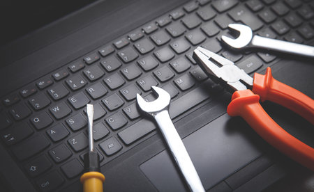 Wrenches on the computer keyboard. IT service. Supportの写真素材