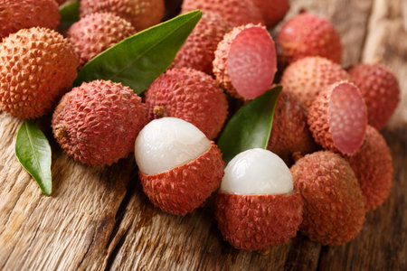 Fresh organic lychee fruit on wood backgroundの写真素材