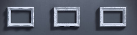 Wide design of picture frames set on textured wallの写真素材
