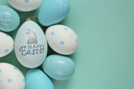 Easter eggs in pastel colors with happy easter text.