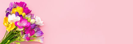 Bouquet of spring flowers isolated on pink backgroundの写真素材