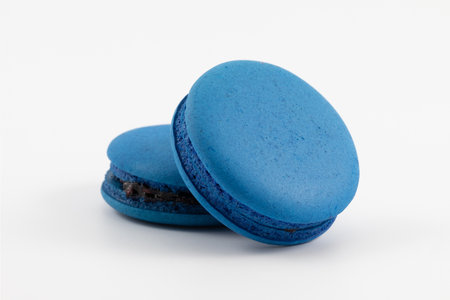 Blue macaron(mixed berry) on white backgroundの写真素材
