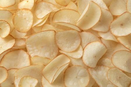 Deep fried crunchy cassava chips close up full frame as backgroundの写真素材