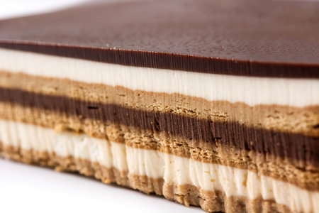 Opera cake dessert isolated on white backgroundの写真素材