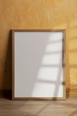 Blank white picture frame on wooden floor and yellow wall background.の写真素材