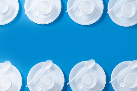 Disposable waste plastic on blue backgroundの写真素材