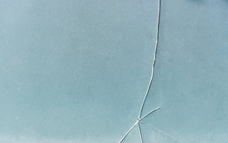 Cracks on glass Thick and opaque glass cracks in vertical, horizontal and oblique lines on the glass...