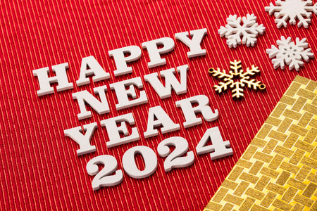 Happy new year 2024 - White wooden letters on red backgroundの写真素材