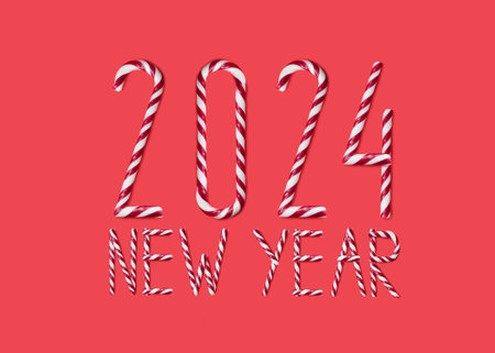 New 2024 year made from sweet caramel canes, candies on red background