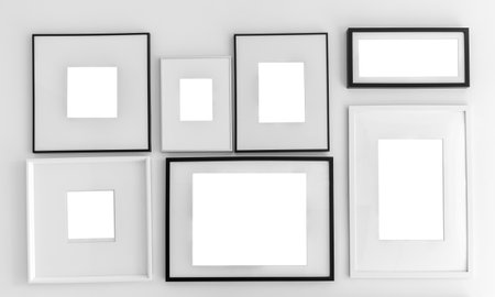 Blank picture frame template set on wallの写真素材