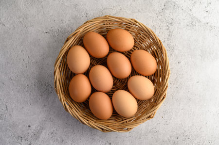 Top view Organic brown eggs several in a wicker basket, preparing for cooking food or dessert, copy...