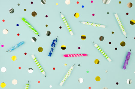 Birthday party background with candles and confetti. Flat lay, top viewの写真素材