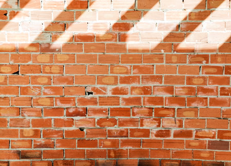 Brick wall texture background. Brickwork with light and shadow.