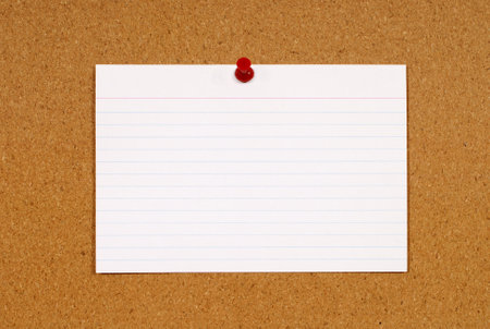 Cork notice or bulletin board with blank white office index card. Space for copy.の写真素材