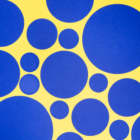 abstract yellow and blue circles on a yellow background with copy spaceの写真素材