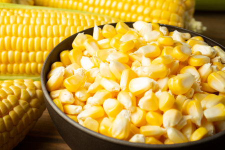 seeds and sweet corn on wooden table.の写真素材