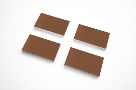 Blank carton business cards on wooden desk background as template for logo, embossing and other esign presentation, pomotion etc.の写真素材