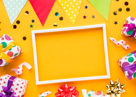 Birthday party background with gift boxes and confetti. Flat lay, top viewの写真素材