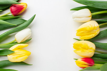 Bouquet of yellow and red tulips on a white backgroundの写真素材