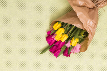 Bouquet of tulips in a paper bagの写真素材
