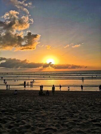 Sunset on beach, Kuta Beach, Bali in Indonesiaの写真素材