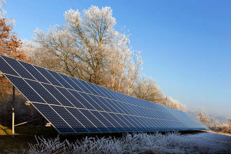 Solar Power Station in the snowy freeze winter Nature