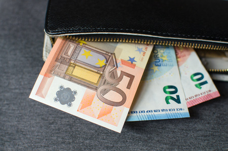 Black leather wallet with money euroの写真素材