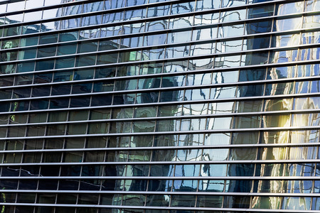 Many windows on the outside of  office building