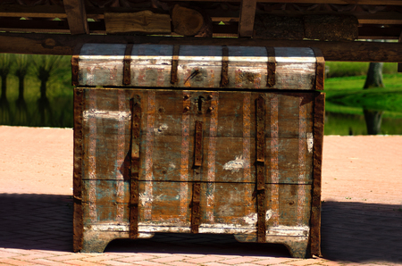 Old rusty chest standing in gardenの写真素材