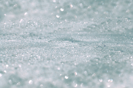 Snow background and bokeh. Fresh snow cover, daytime light at winterの写真素材
