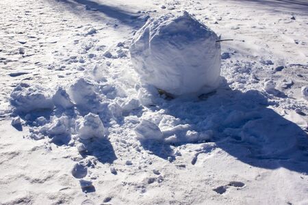 winter snow surface with patterns created by wind and other natural phenomena