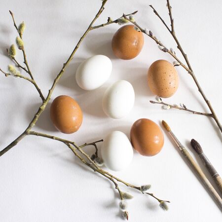 Happy Easter on a white background. Easter decor. Flat lay. Top view.