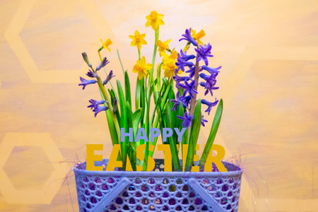 a very peri basket with spring flowers - yellow daffodils and purple hyacinths, and red painted...