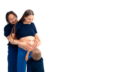beautiful european happy family with a pregnant mother, the father and a son together. High quality...