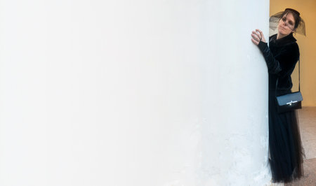 Elegant faceless woman in black vintage dress. Concept of Halloween, party, celebration, imagination, fantasy. Poster, ad. Banner with copy spaceの写真素材