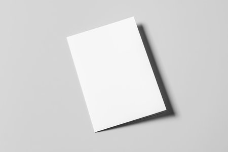 A4 Bi-Fold Brochure Mockup on Gray Background. 3D Rendering in Handの写真素材