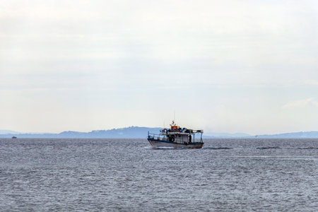 Fishing Adventures: Fisher in Small Boat at Sea in Tunisia, North Africaの写真素材
