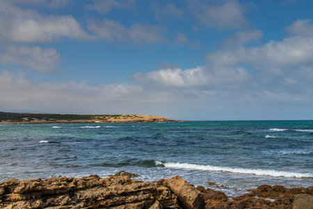 Deserted Wild Beach with Mountains and Sea in Tunisia, North Africaの写真素材