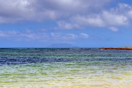 Deserted Wild Beach with Mountains and Sea in Tunisia, North Africaの写真素材