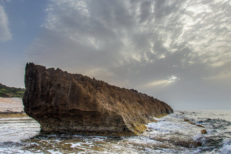 Mountains Embrace the Shore: Rimel's Scenic Beachscape in Bizerte, Tunisiaの写真素材
