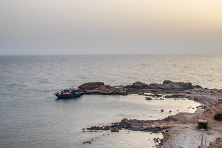 Fishing Adventures: Fisher in Small Boat at Sea in Tunisia, North Africaの写真素材