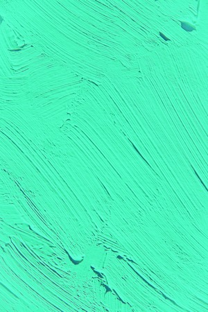 Painting close up of vivid turquoise light green color, paint brush strokes  texture for interesting, creative, imaginative backgrounds. For web and design.の写真素材