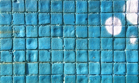 Painted mosaic brick tile wall, close up of graffiti texture, with vibrant colors for creativity, imaginative backgrounds and ideas.の写真素材