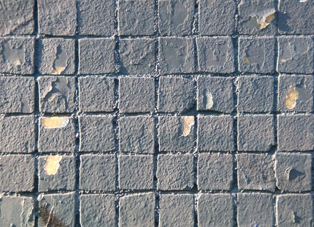 Painted mosaic brick tile wall, close up of graffiti texture, with vibrant colors for creativity, imaginative backgrounds and ideas.の写真素材