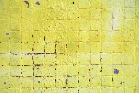 Painted mosaic brick tile wall, close up of graffiti texture, with vibrant colors for creativity, imaginative backgrounds and ideas.の写真素材