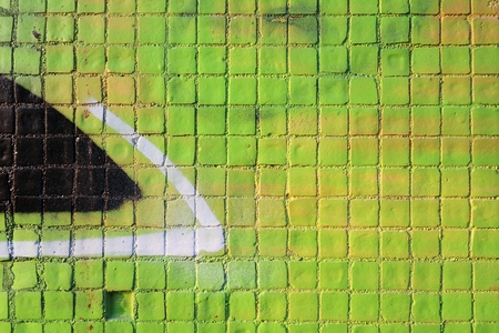 Painted mosaic brick tile wall, close up of graffiti texture, with vibrant colors for creativity, imaginative backgrounds and ideas.の写真素材